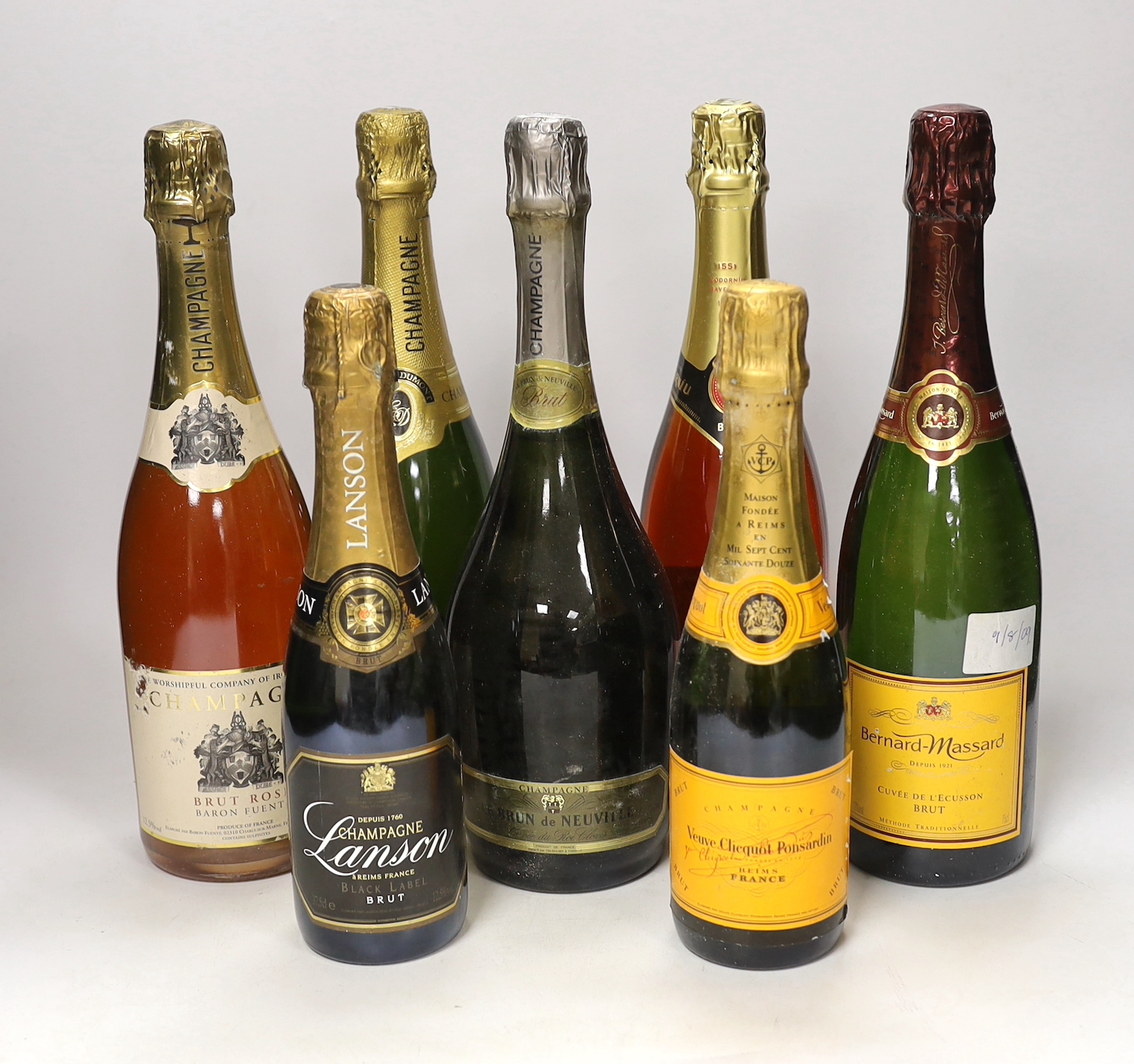 Seven assorted full or half bottles of Champagne and other sparkling wine, including Lanson and Veuve Clicquot.